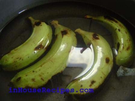 Add 1 liter of water and raw Bananas in a pressure Cooker.